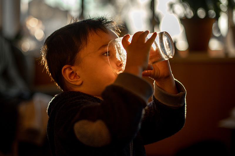 little child drinking smart water