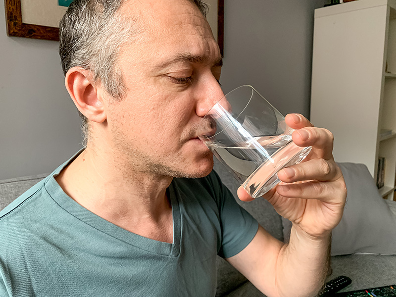 middle aged man having water